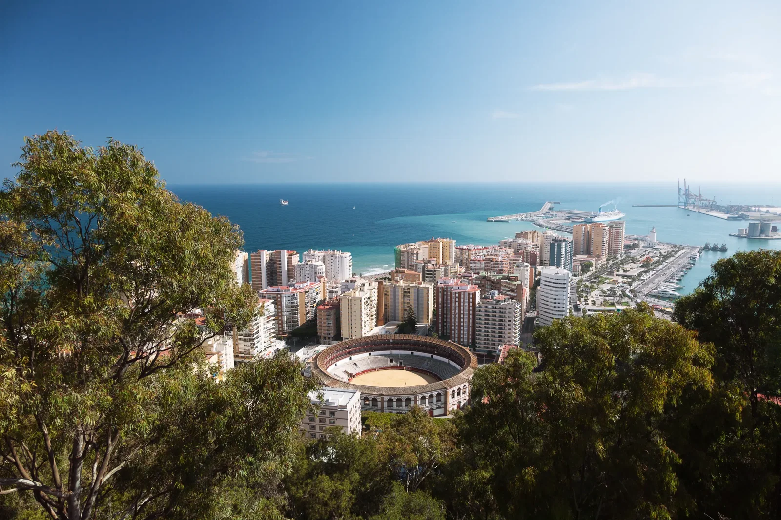 View of the city of Malaga, with the Bullring of La Malagueta and the Port. malaga